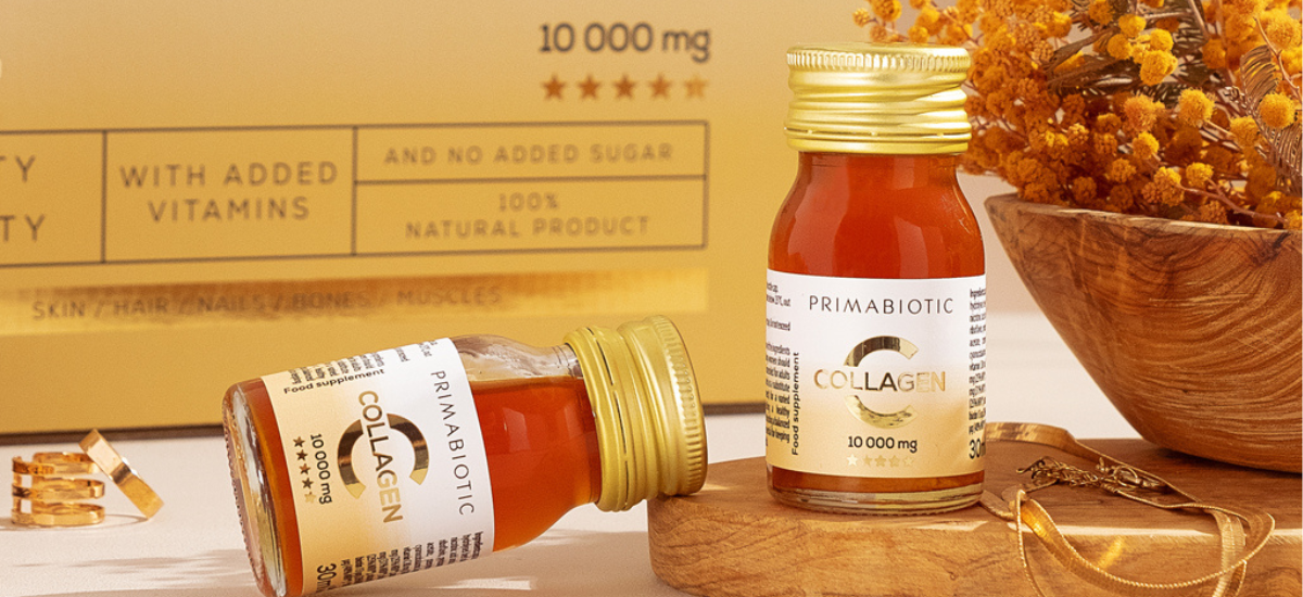 Primabiotic Collagen 10,000 mg shots with vitamins on a wooden tray - natural beauty supplement for skin and hair