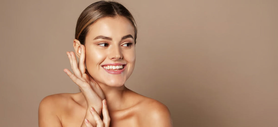 Smiling woman with radiant, healthy skin showing the glass skin effect after Primabiotic Collagen supplementation