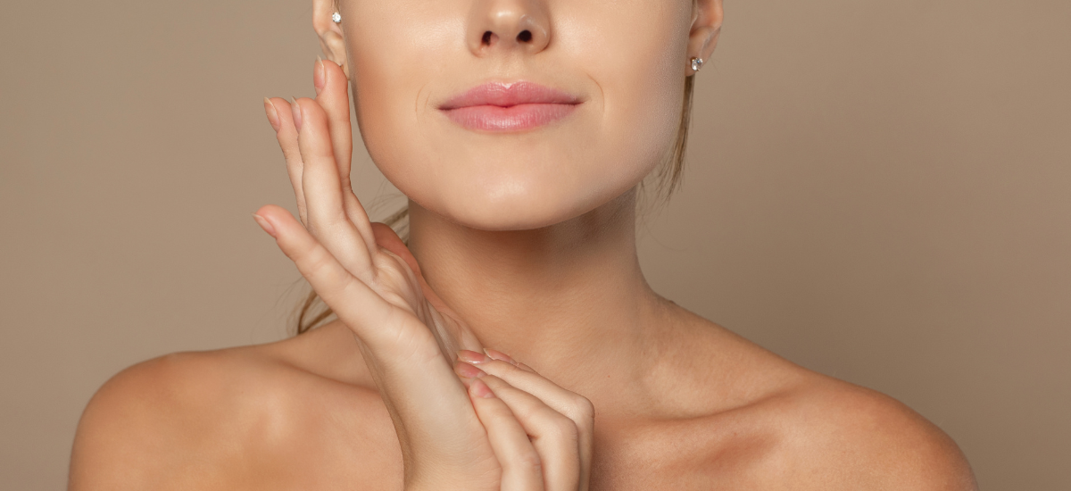 Woman touches the smooth skin of her face