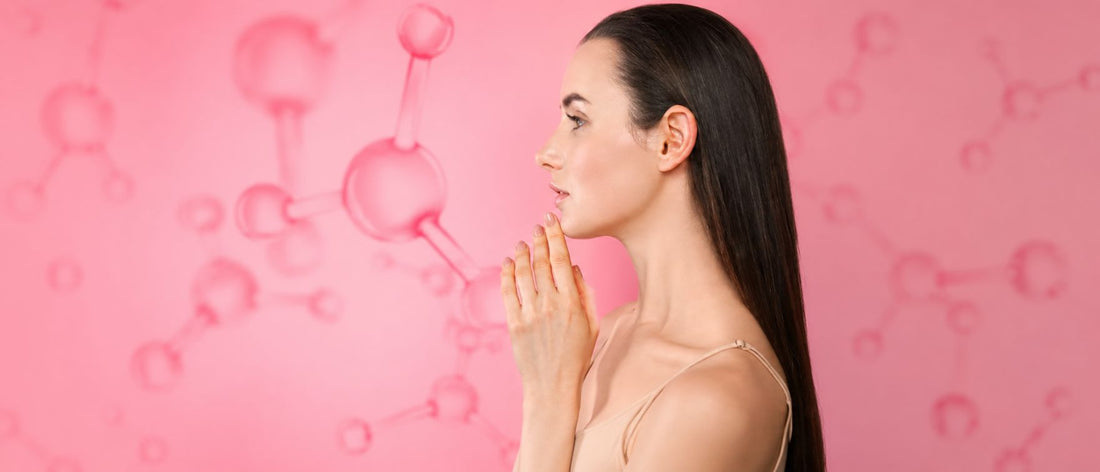 Young dark-haired woman showing her radiant, wrinkle-free skin after Primabiotic collagen supplementation, against a background of collagen peptides