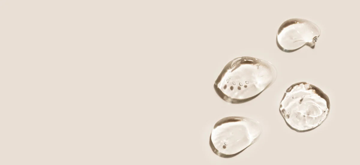 The photo shows hyaluronic acid on a beige background.