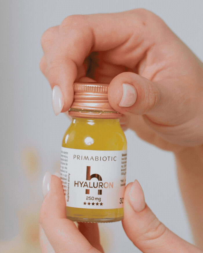 Woman drinking a Primabiotic Hyaluron shot, enjoying its taste and hydrating benefits for glowing, healthy skin.
