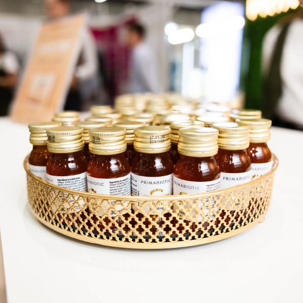 many primabiotic collagen bottles displayed at the gold tray