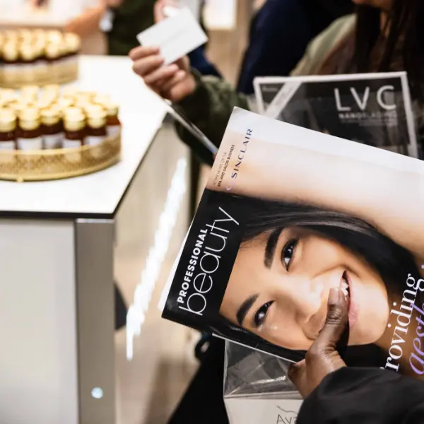 lady holding a professional beauty magazine